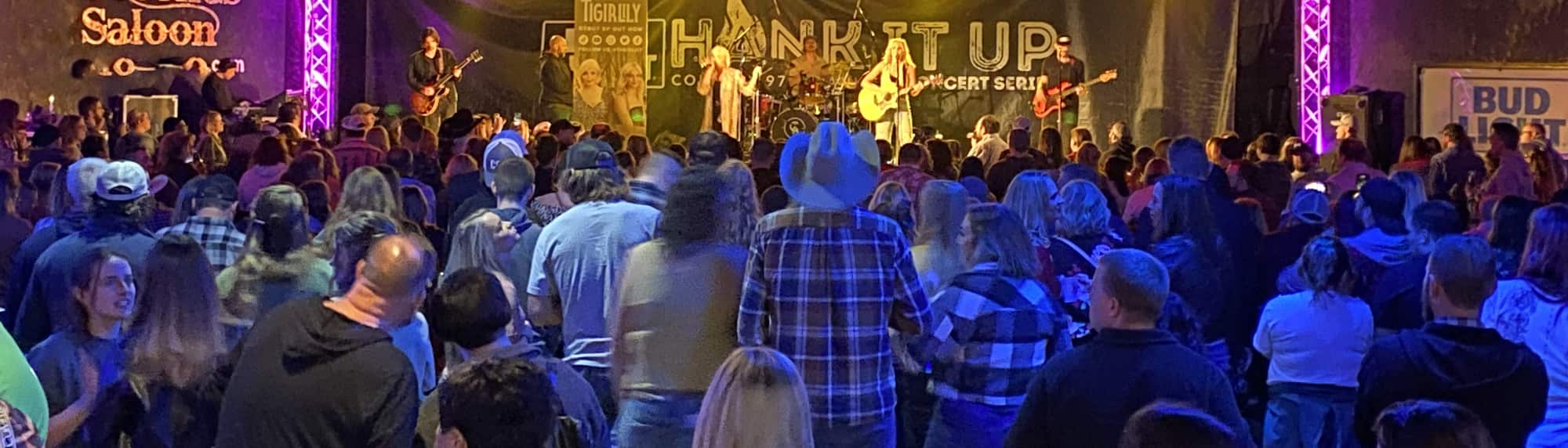 country concert with fans wearing cowboy hats Palm Springs